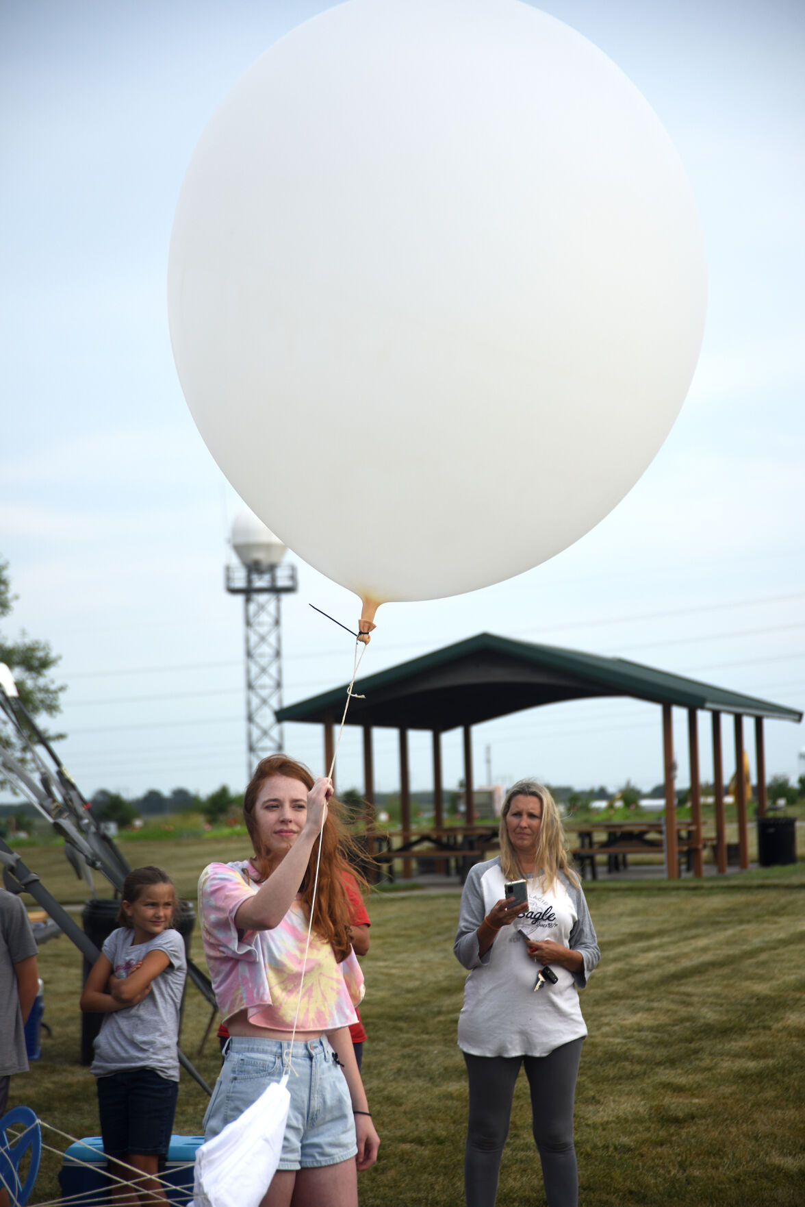 Libby Orr, an MU meteorology student, holds a weather balloon